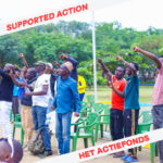 People raising their fists. IN red on a white background in the corners it says: "Supported action; Het Actiefonds."